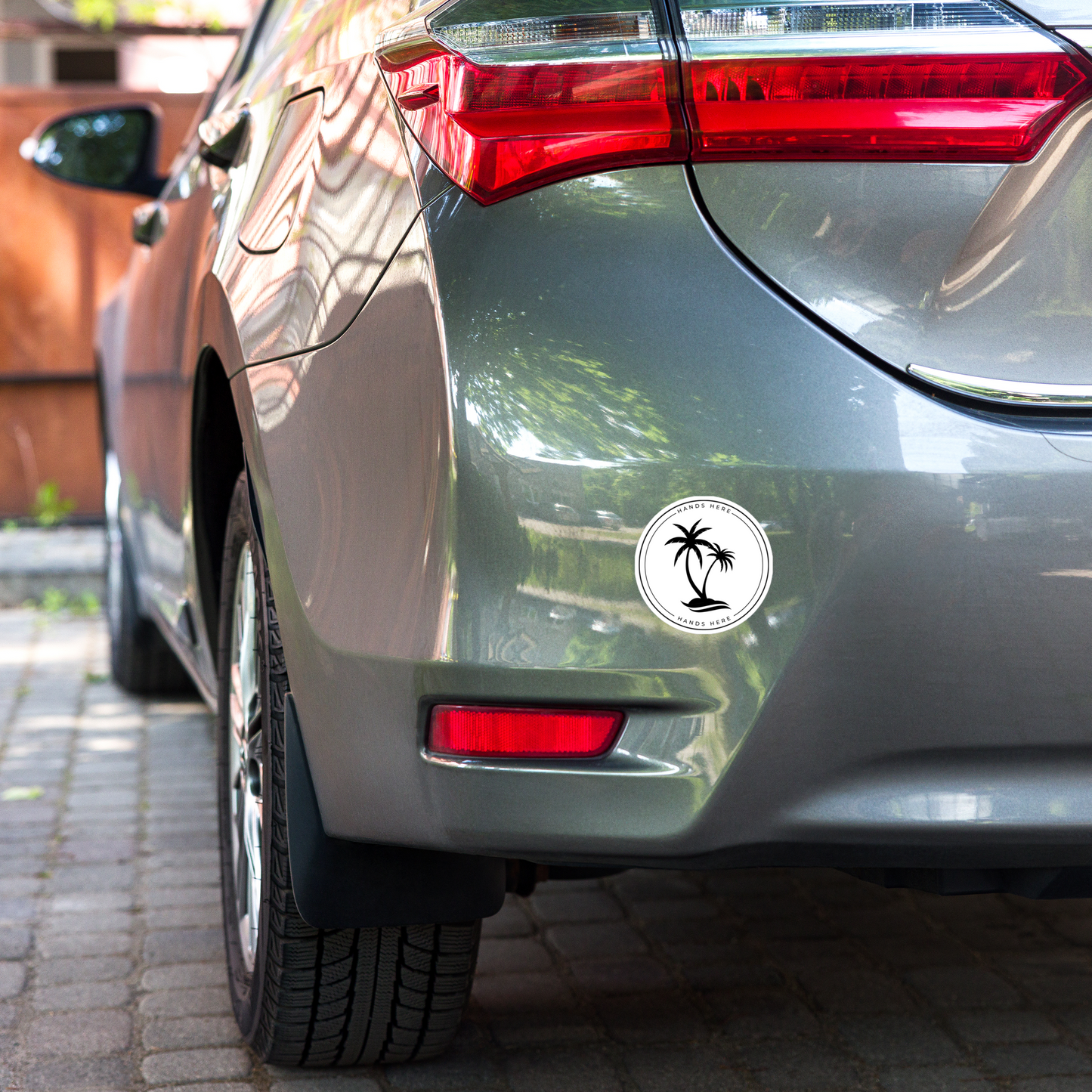 Magnet on rear panel of grey car
